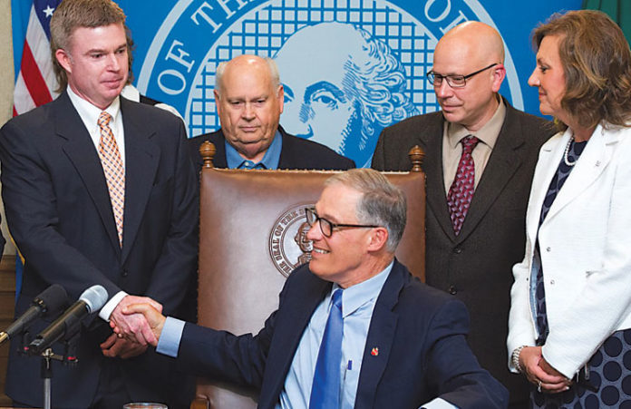 Governor-Inslee-congratulates-Eric-Temple-at-SB-5517-Signing Gov. Inslee congratulates
