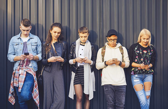marketing_to_gen_z Five people with cell phones