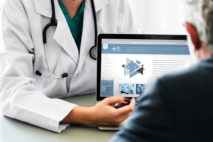 ScruggsColumn Doctor explains to patient
