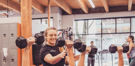 Personal trainer and two clients