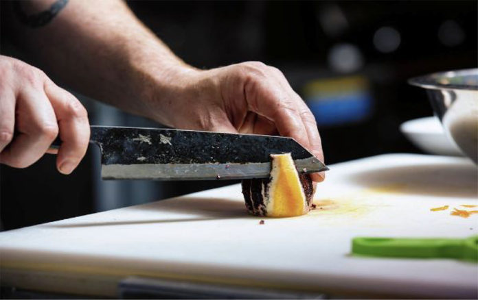 Hickory Person cutting vegetables